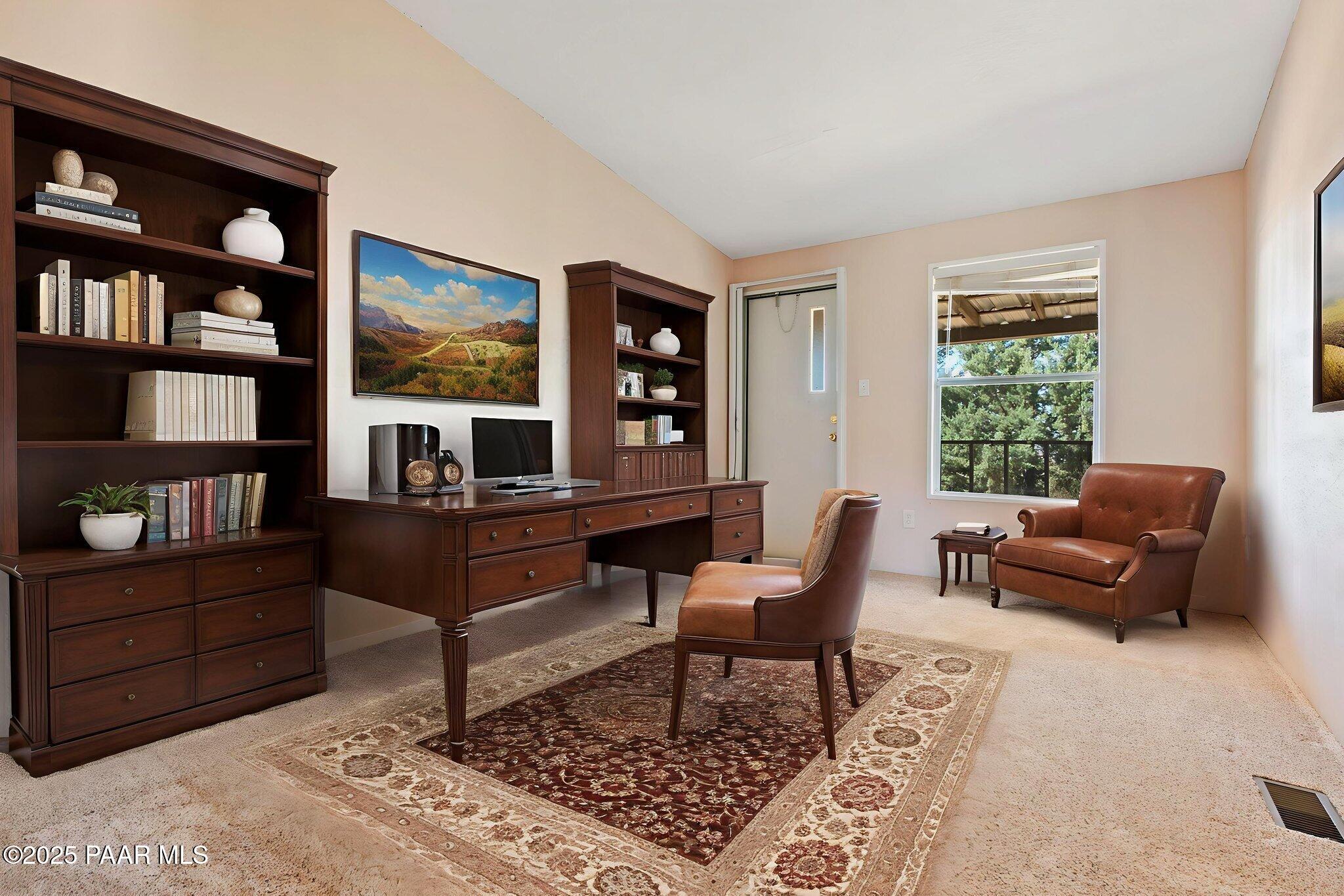 18125 East Roper Way Dewey, AZ 86327 - Photo 25 of 63 a living room with furniture and a window with a bookshelf