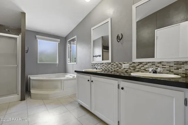 a bathroom with a bathtub and a shower