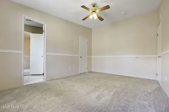 a bathroom with a sink a toilet and shower curtain