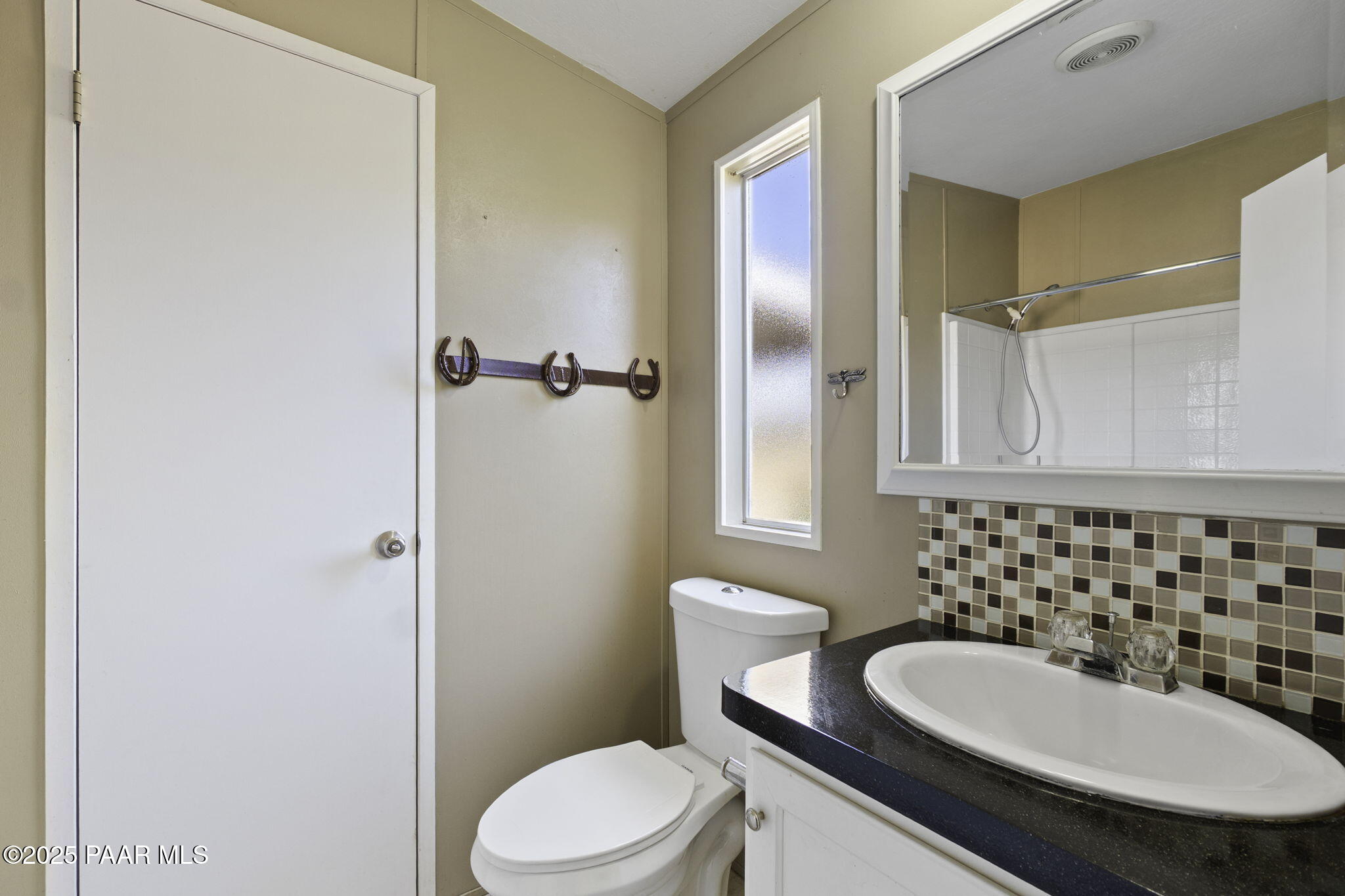 18125 East Roper Way Dewey, AZ 86327 - Photo 34 of 63 a bathroom with a sink a toilet and shower