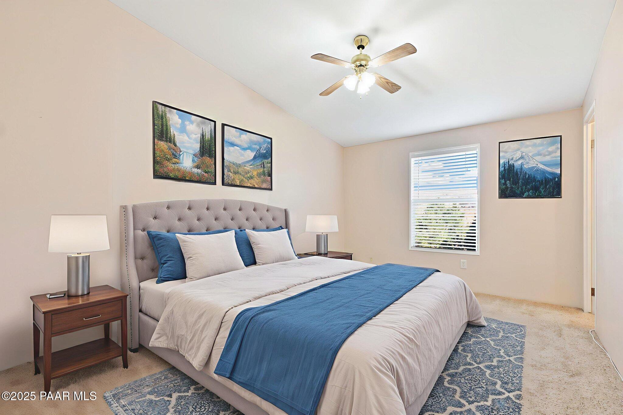 18125 East Roper Way Dewey, AZ 86327 - Photo 39 of 63 a bedroom with a bed and a painting on the wall