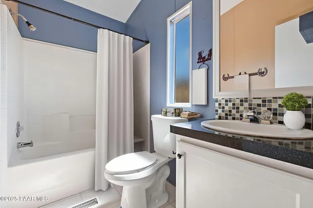 a view of a patio with table and chairs and wooden floor
