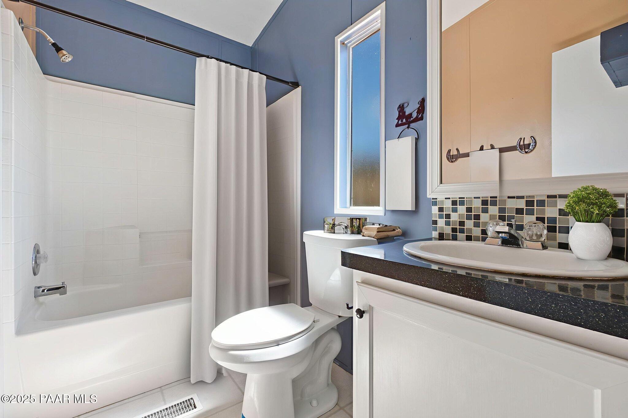 18125 East Roper Way Dewey, AZ 86327 - Photo 41 of 63 a bathroom with a sink a toilet and shower