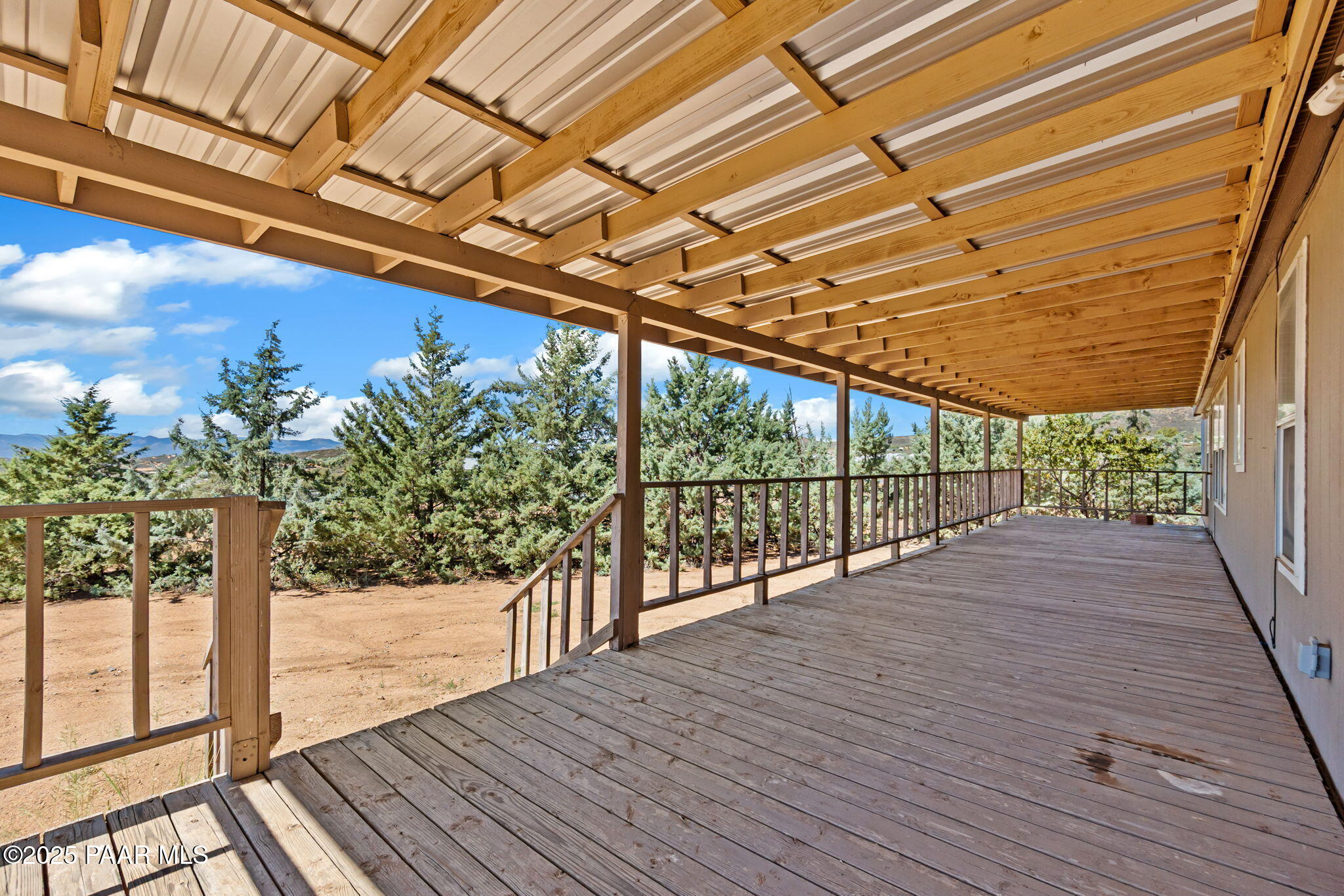 18125 East Roper Way Dewey, AZ 86327 - Photo 43 of 63 a view of porch with wooden floor and floor to ceiling window