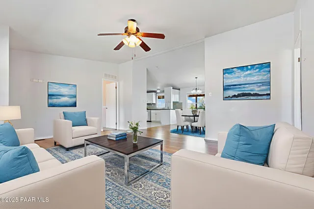 a view of a kitchen with wooden floor and a chandelier