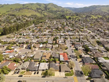 an aerial view of residential houses with outdoor space