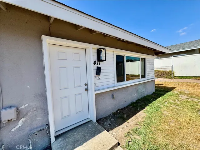 a view of a porch with wooden floor and fence