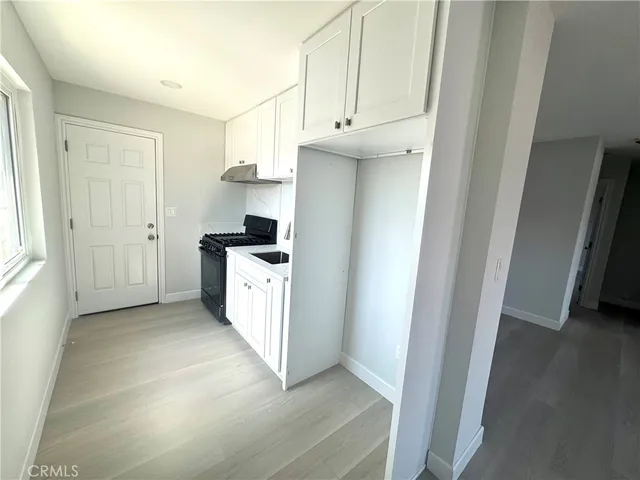 a view of a kitchen with refrigerator and dishwasher