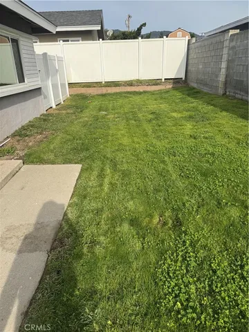 a view of a yard with an empty space