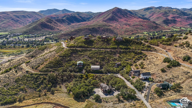 380 Luzern Road Midway, UT 84049 - Photo 35 of 41 Mountainous terrain with natural landscaping, visible residential structures, and paved roadways