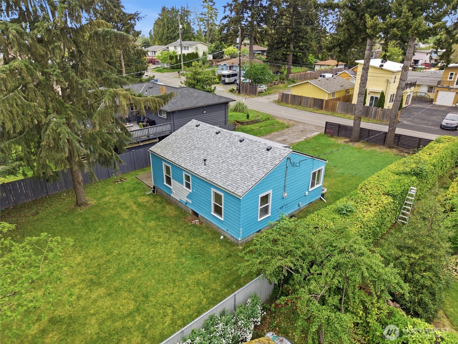 1651 Southwest 114th Street Seattle, WA 98146 - Photo 26 of 37 aerial view of a house with a yard and sitting area