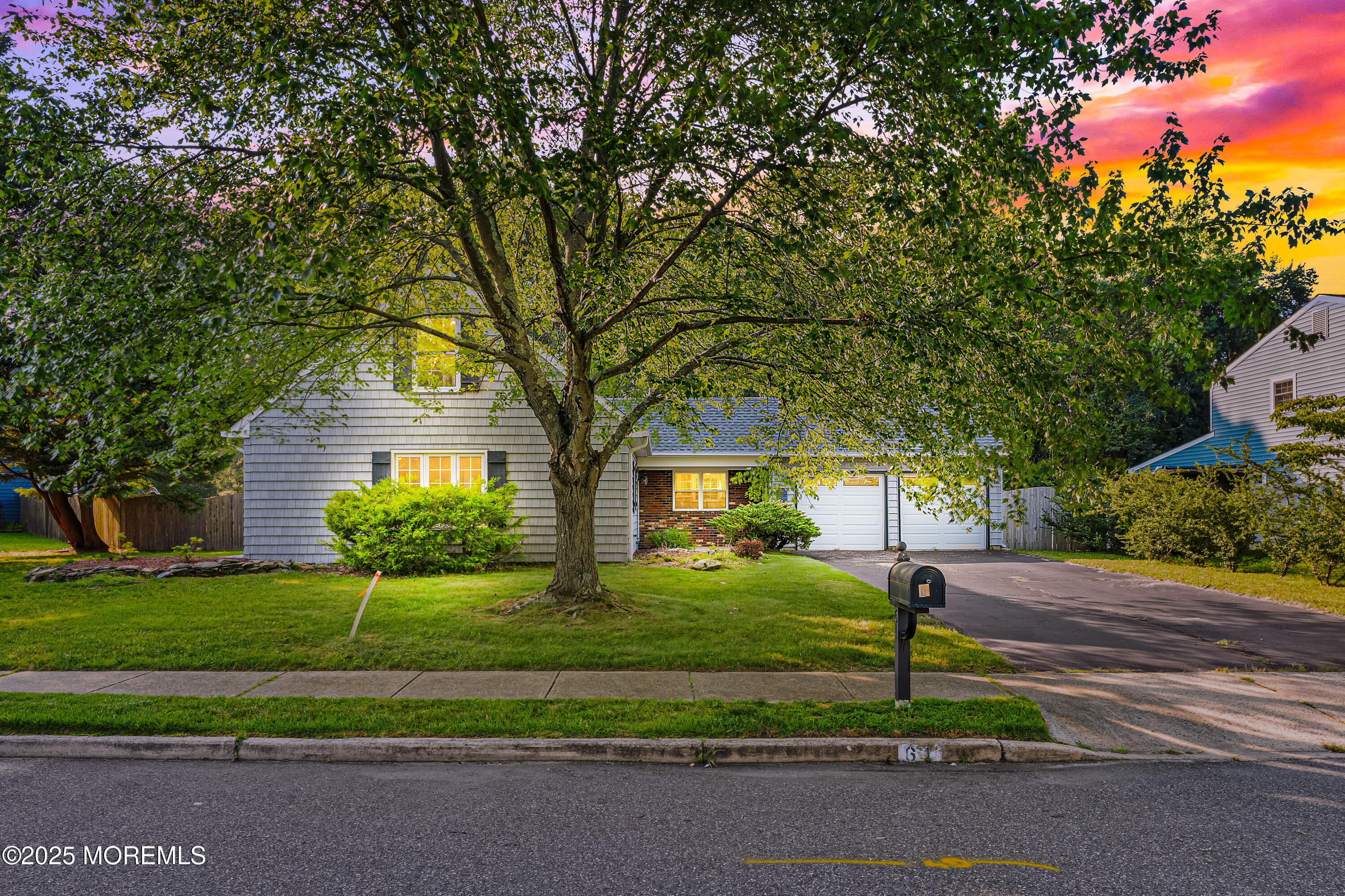 61 Berkshire Drive Howell, NJ 07731 - Photo 1 of 43 a front view of a house with a yard