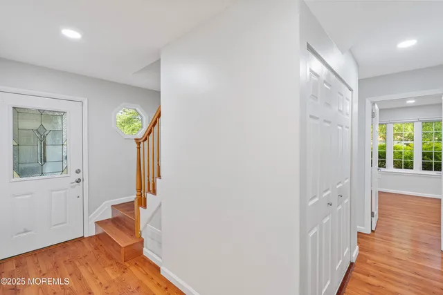 a view of entryway with wooden floor