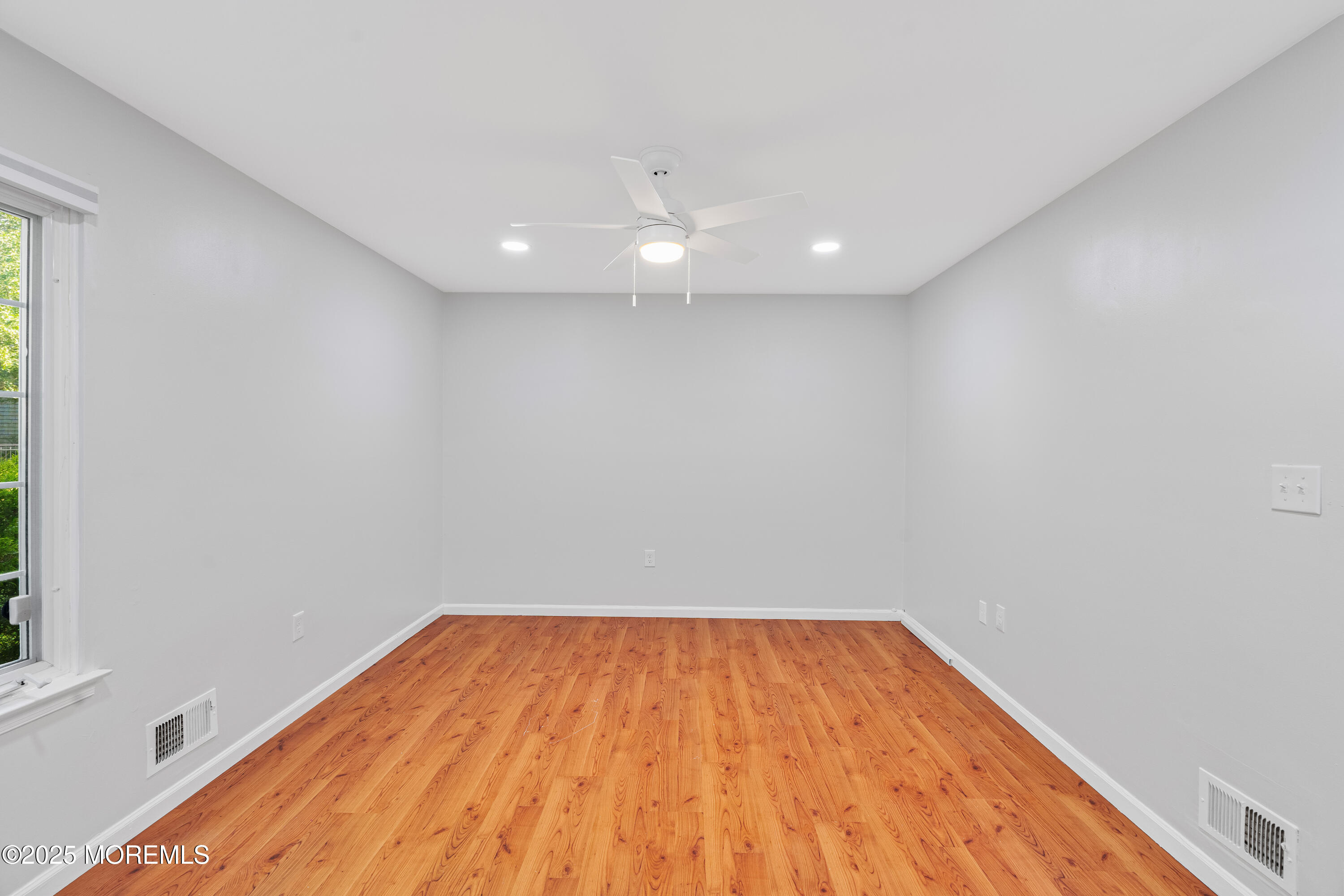 61 Berkshire Drive Howell, NJ 07731 - Photo 28 of 43 a view of empty room with wooden floor