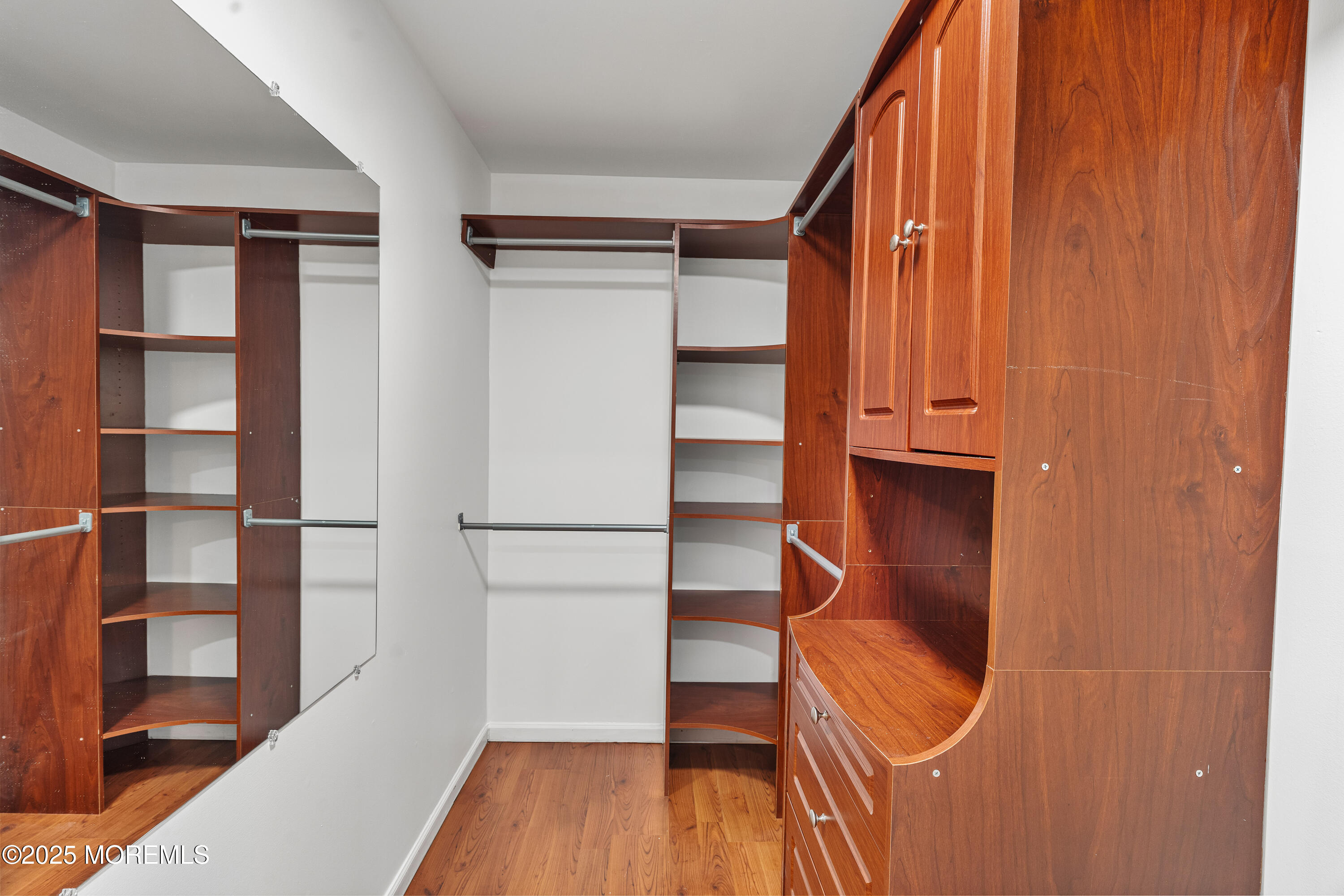 61 Berkshire Drive Howell, NJ 07731 - Photo 31 of 43 a view of walk in closet with empty racks