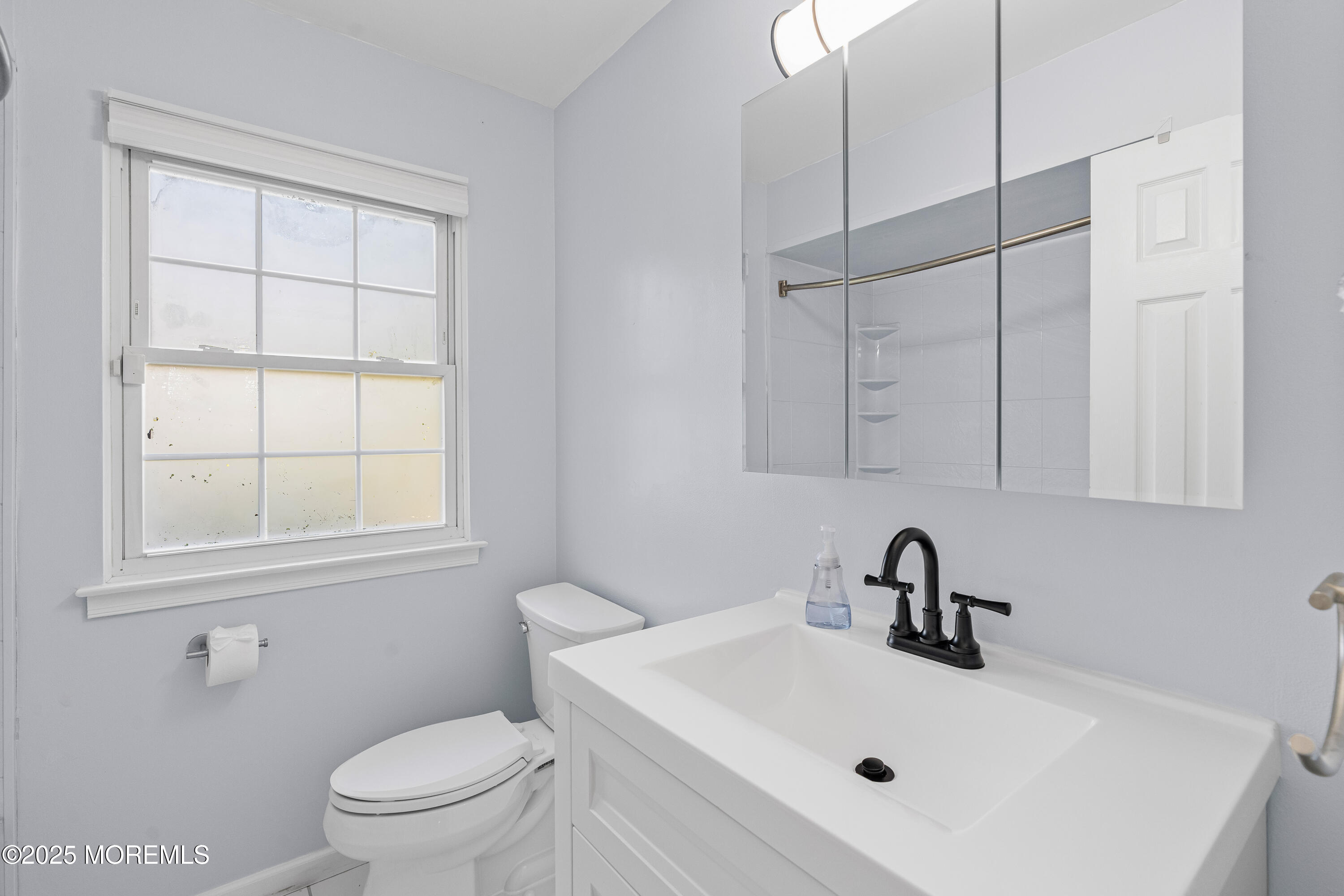 61 Berkshire Drive Howell, NJ 07731 - Photo 33 of 43 a bathroom with a sink toilet and mirror