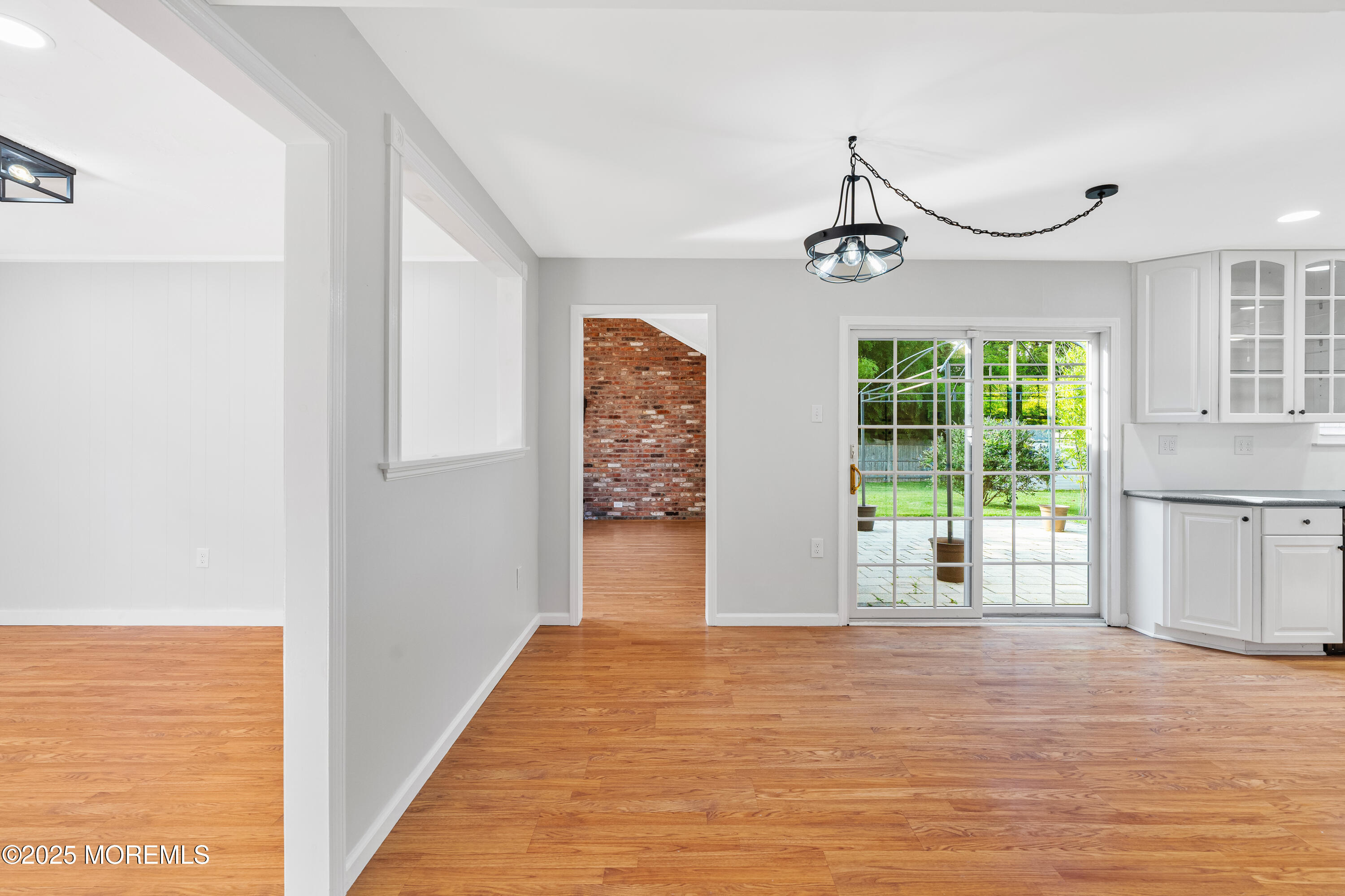 61 Berkshire Drive Howell, NJ 07731 - Photo 36 of 43 a view of empty room with wooden floor and fan