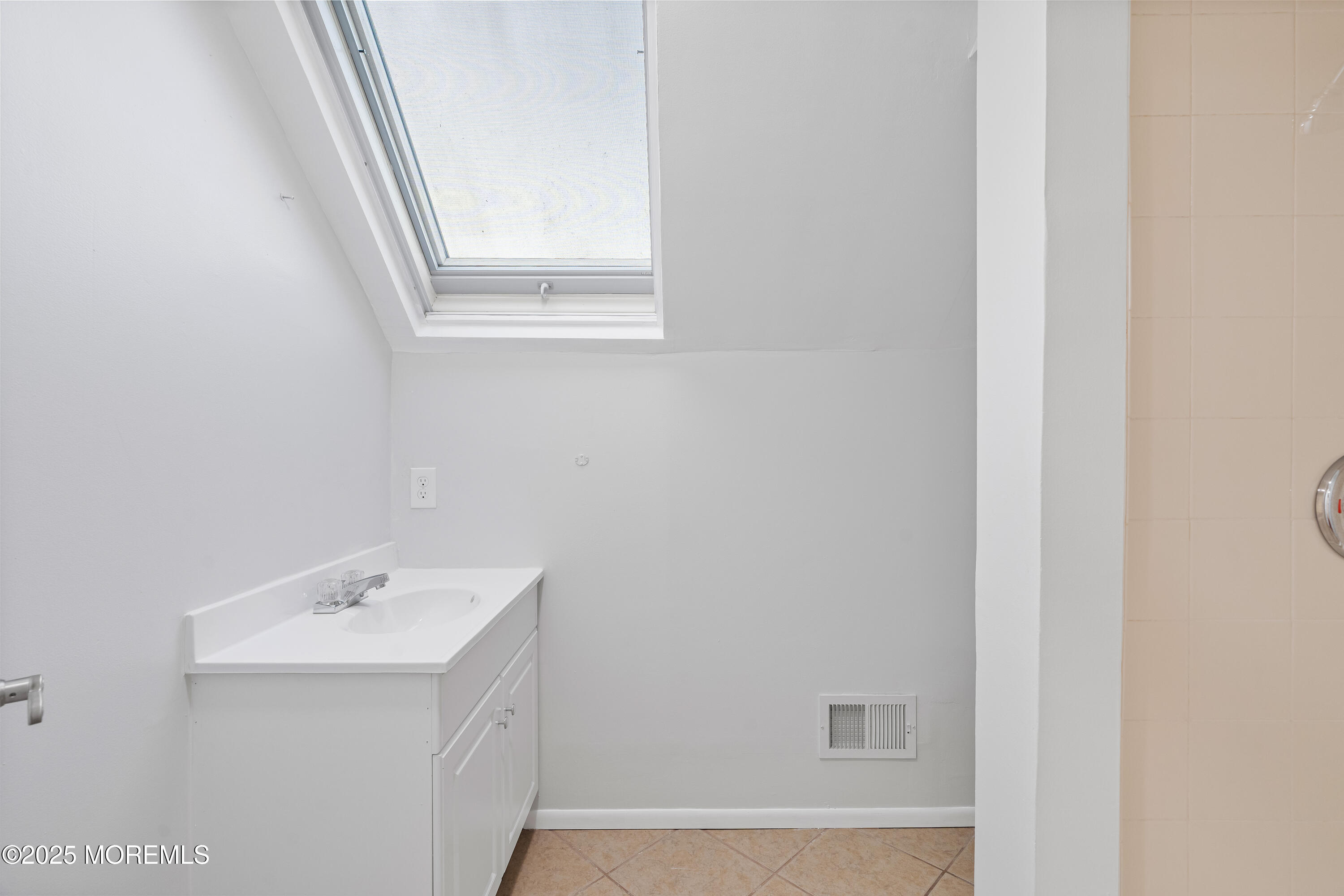 61 Berkshire Drive Howell, NJ 07731 - Photo 42 of 43 a bathroom with a sink a window and a mirror
