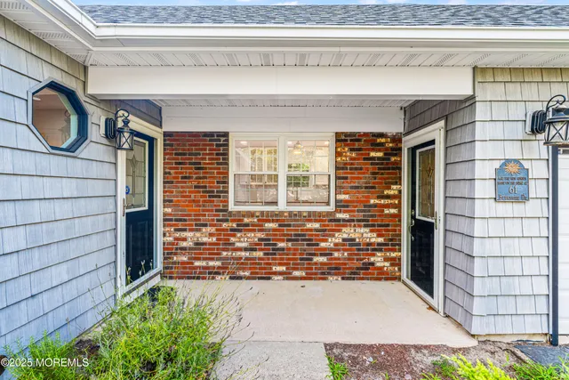a view of front door of house with window