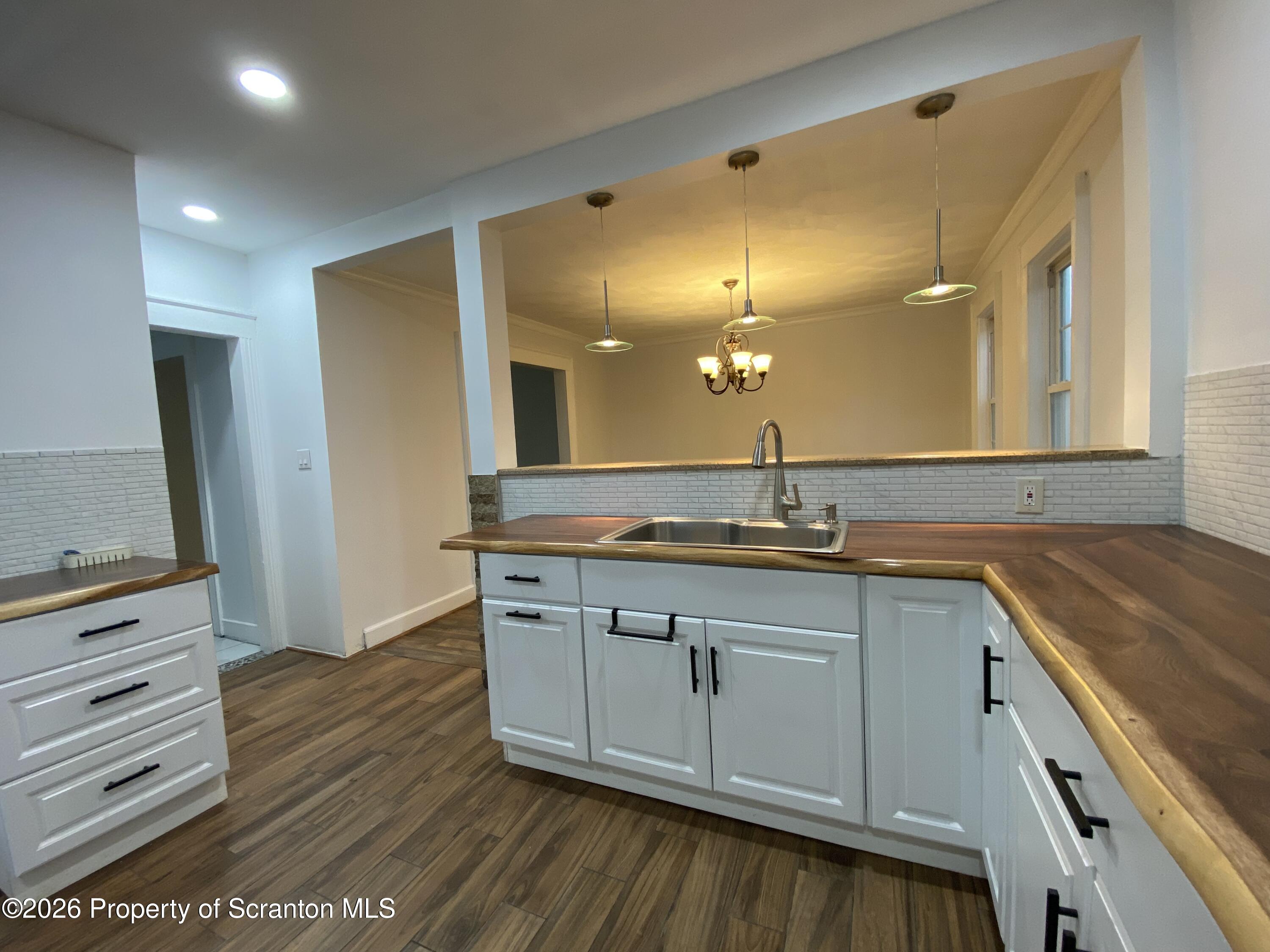 1827 Prospect Avenue Scranton, PA 18505 - Photo 12 of 48 a bathroom with a sink and a mirror