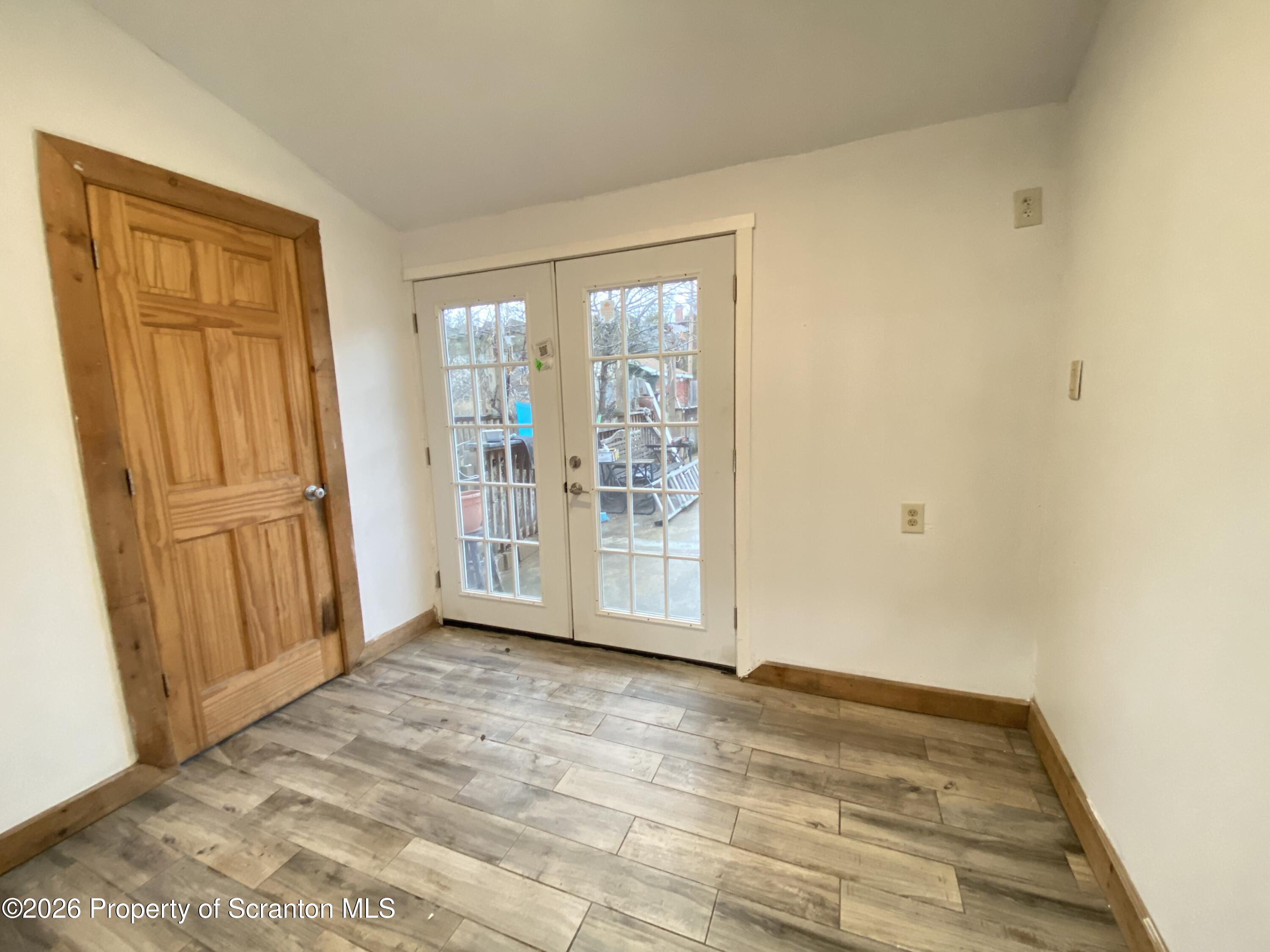 1827 Prospect Avenue Scranton, PA 18505 - Photo 15 of 48 a view of empty room with wooden floor and fan