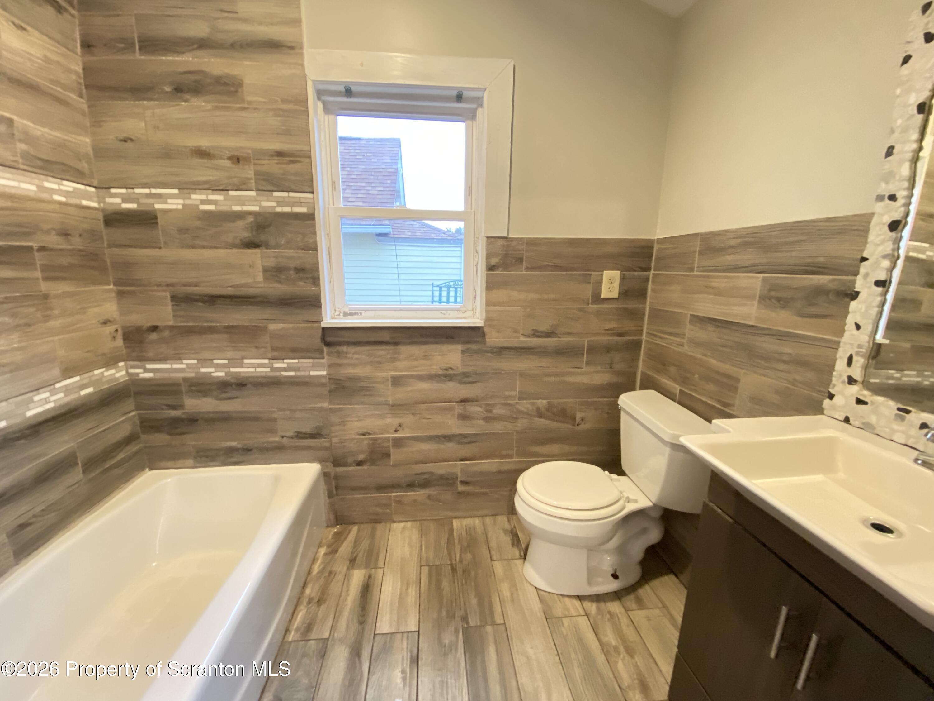 1827 Prospect Avenue Scranton, PA 18505 - Photo 16 of 48 a bathroom with a sink and a toilet
