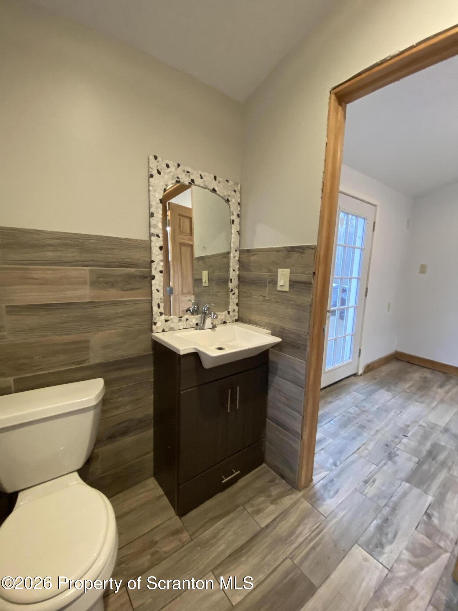 1827 Prospect Avenue Scranton, PA 18505 - Photo 17 of 48 a bathroom with a sink toilet and mirror