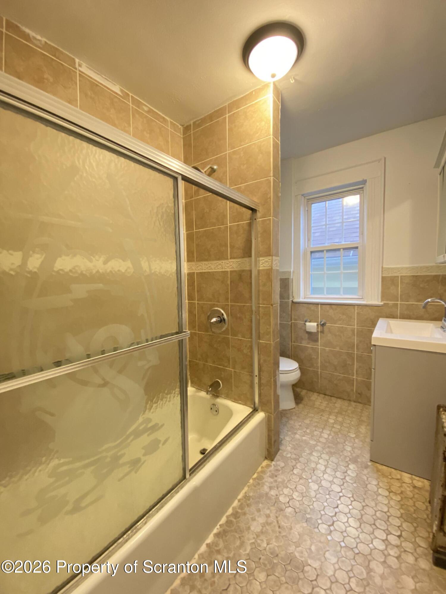 1827 Prospect Avenue Scranton, PA 18505 - Photo 23 of 48 a bathroom with a bathtub and a shower