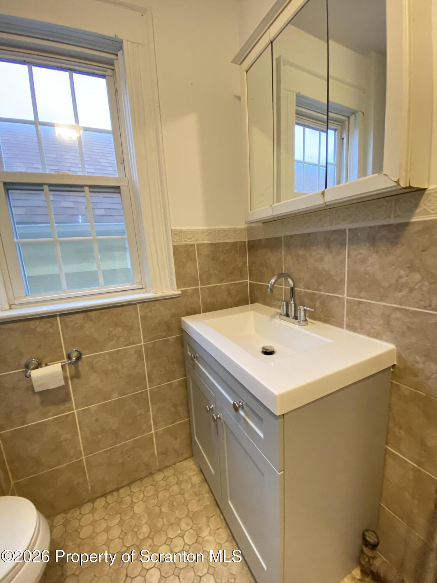 1827 Prospect Avenue Scranton, PA 18505 - Photo 24 of 48 a bathroom with a sink and a shower