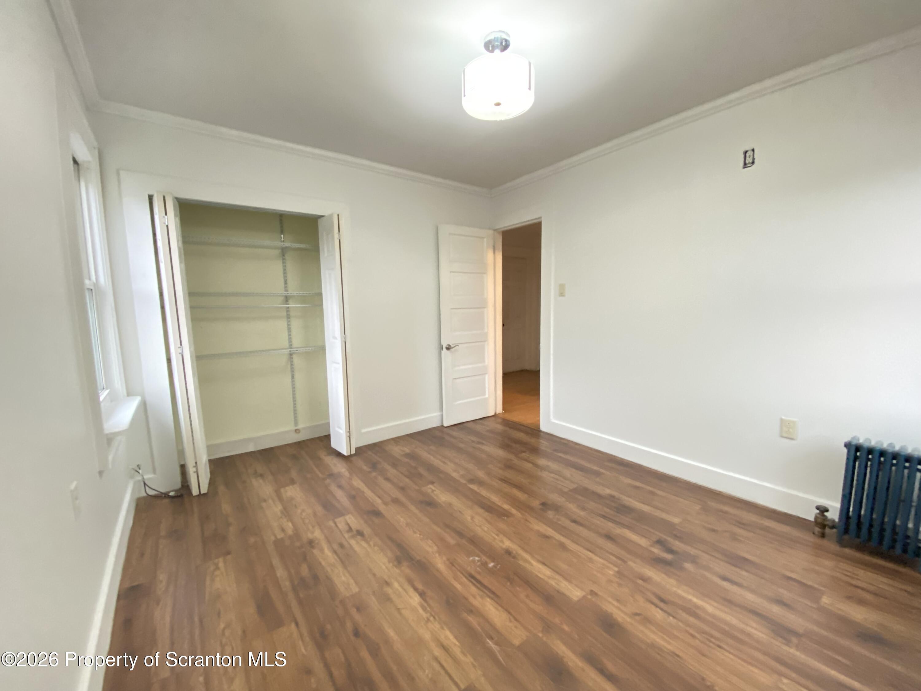 1827 Prospect Avenue Scranton, PA 18505 - Photo 29 of 48 an empty room with wooden floor and closet