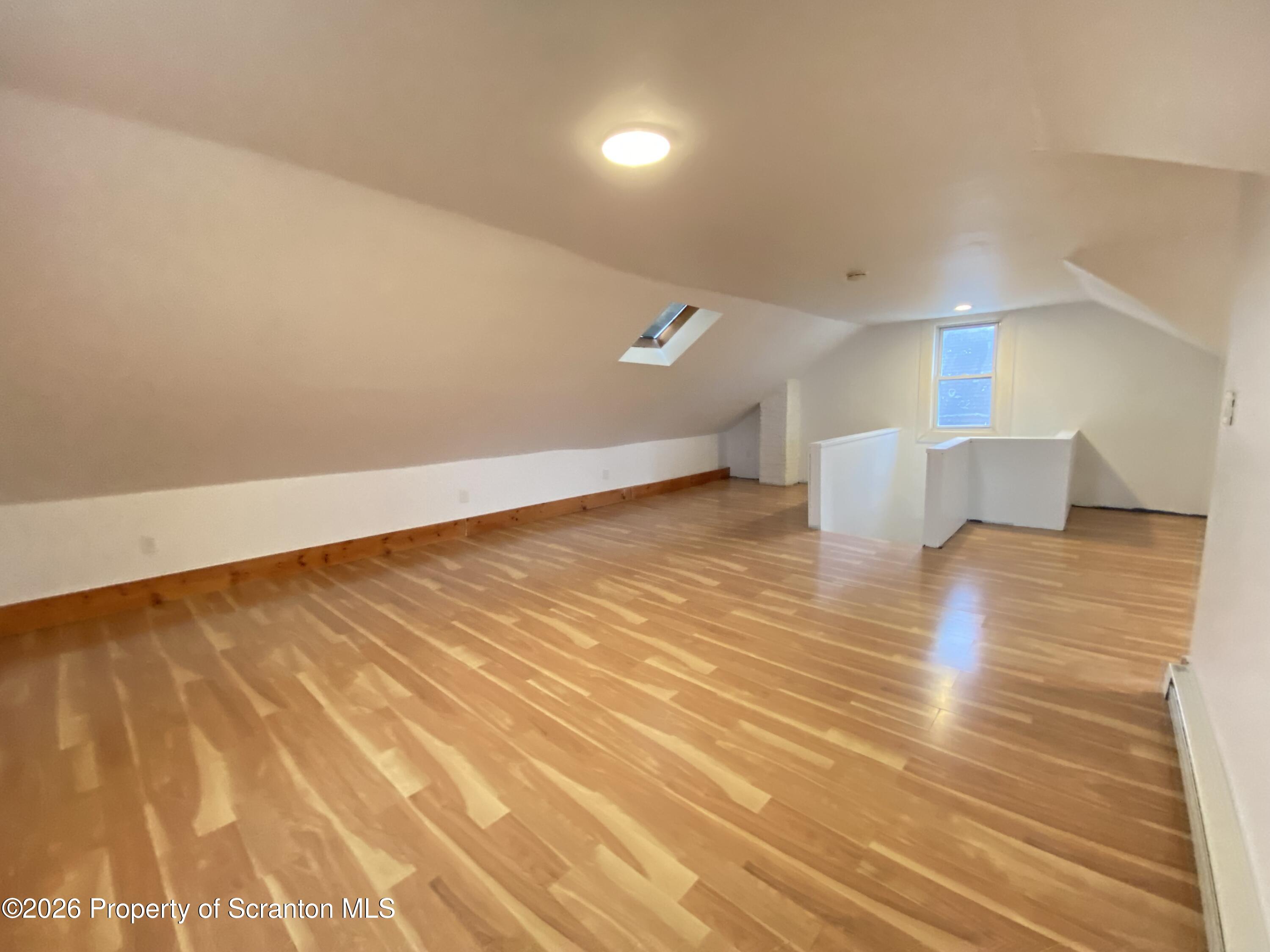 1827 Prospect Avenue Scranton, PA 18505 - Photo 36 of 48 a view of empty room with wooden floor