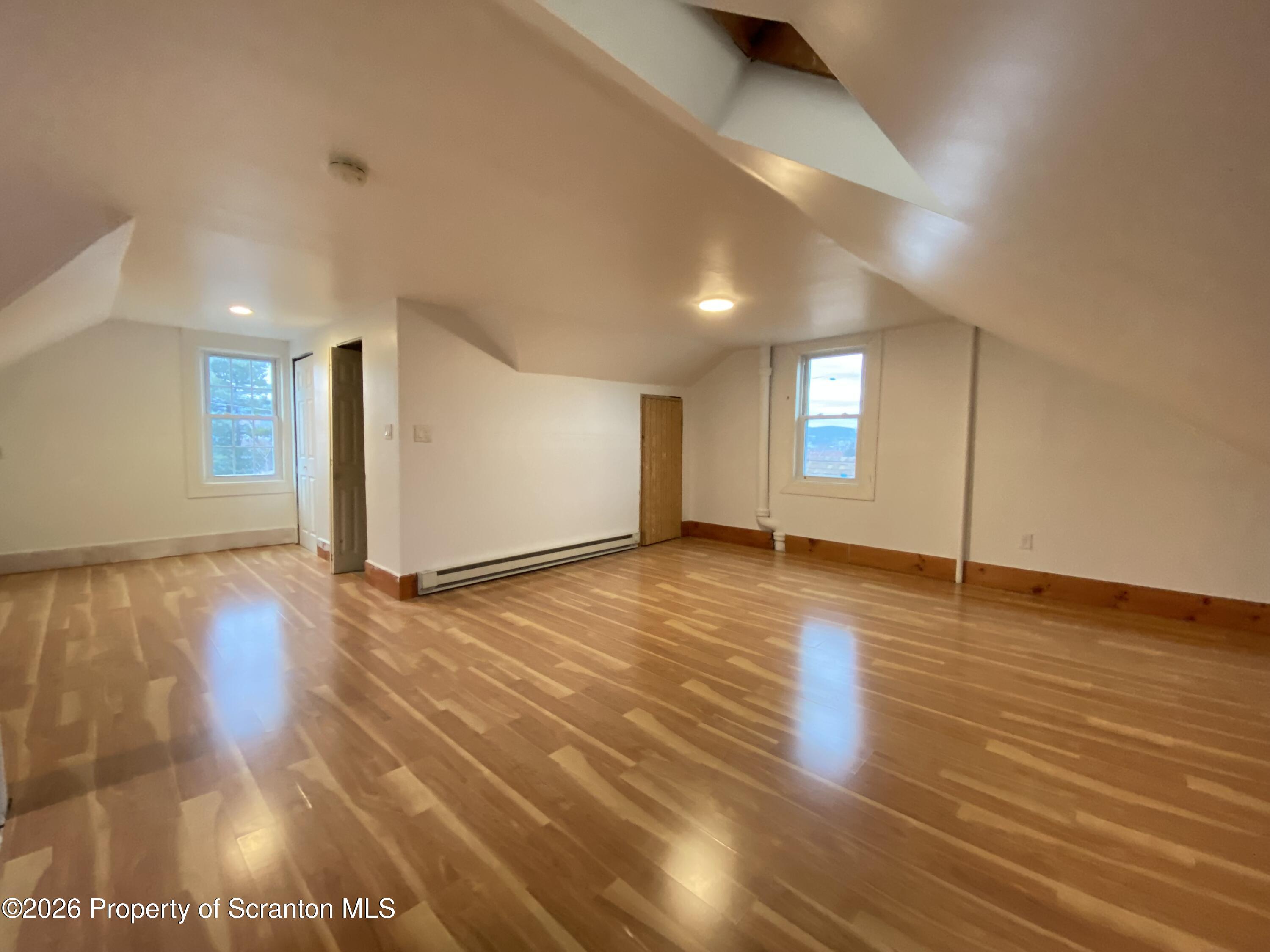 1827 Prospect Avenue Scranton, PA 18505 - Photo 37 of 48 a view of empty room with wooden floor and fan