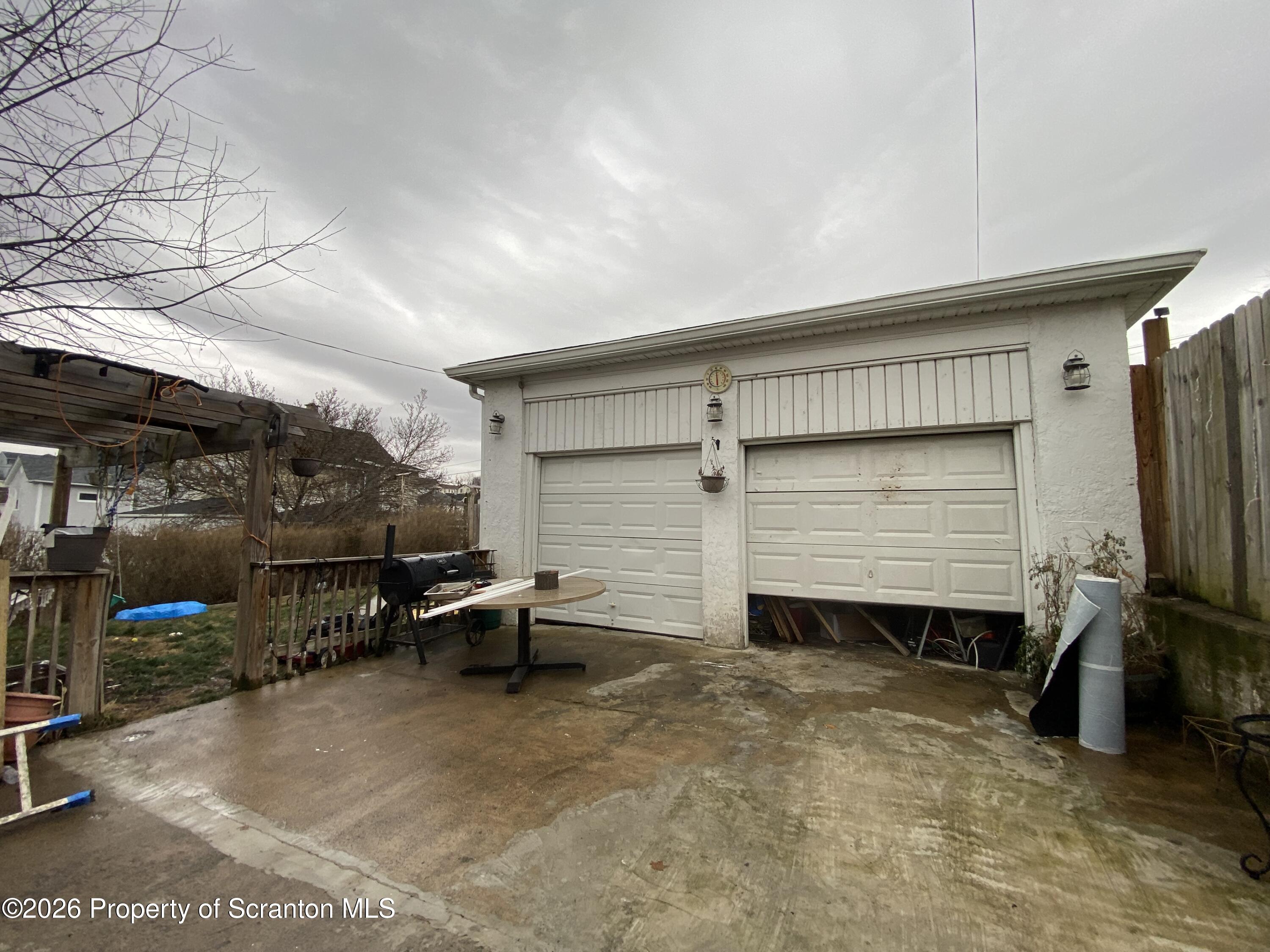 1827 Prospect Avenue Scranton, PA 18505 - Photo 45 of 48 a view of backyard with wheel chair and potted plants