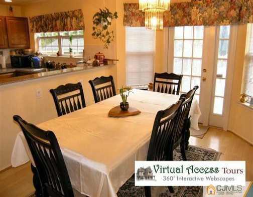 67 Springfield Road North Brunswick, NJ 08902 - Photo 3 of 8 a view of a dining room with furniture and window