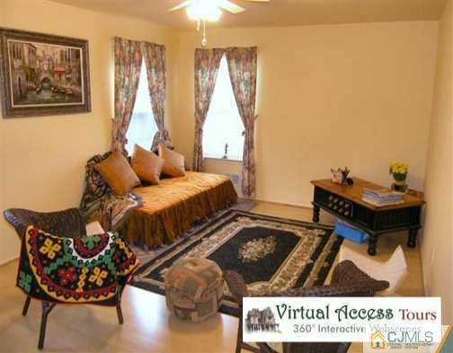 67 Springfield Road North Brunswick, NJ 08902 - Photo 4 of 8 a living room with furniture and a large window