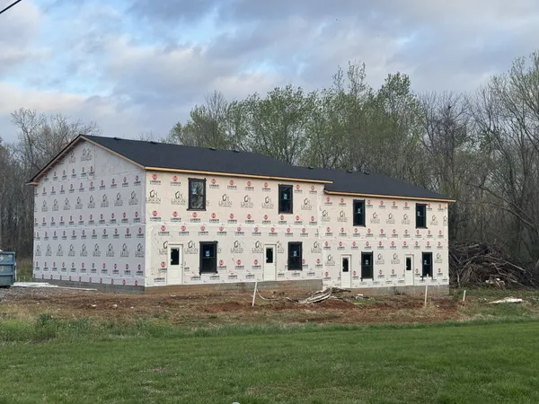 a view of building with yard
