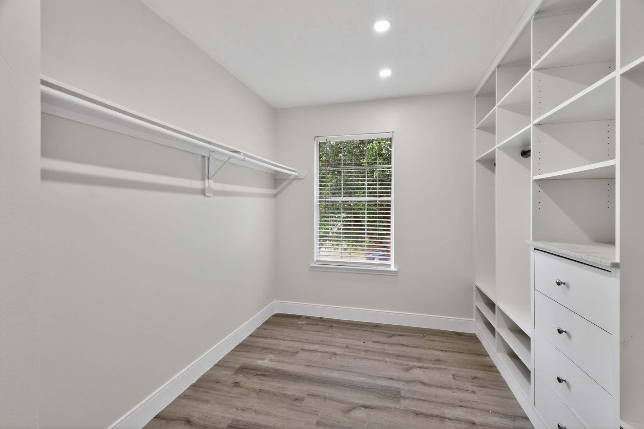 918 Ivycroft Lane Spring, TX 77373 - Photo 24 of 33 a view of an empty room with wooden floor and a window