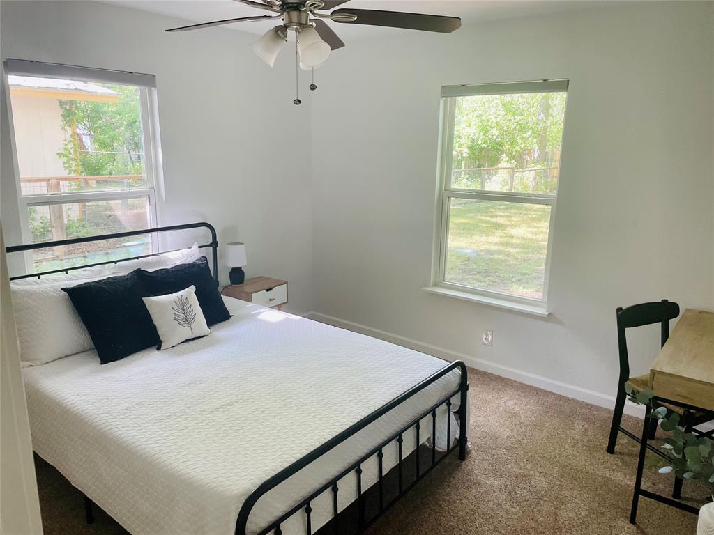 3208 Thompson Street Austin, TX 78702 - Photo 13 of 16 a bedroom with a bed and a window