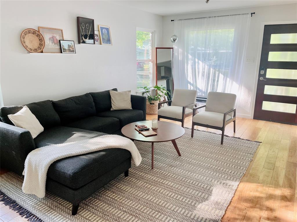 3208 Thompson Street Austin, TX 78702 - Photo 2 of 16 a living room with furniture and a rug