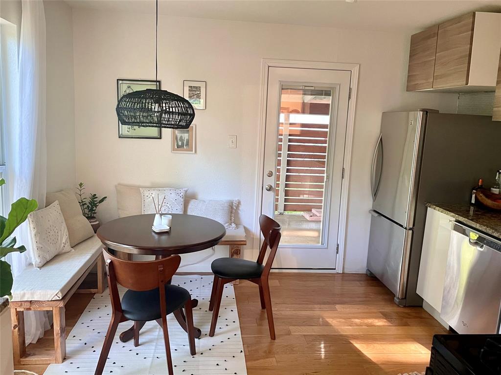 3208 Thompson Street Austin, TX 78702 - Photo 5 of 16 a view of a dining room with furniture window and wooden floor