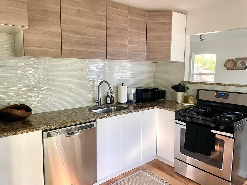 3208 Thompson Street Austin, TX 78702 - Photo 6 of 16 a kitchen with a sink and a stove