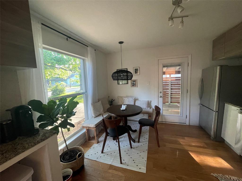 3208 Thompson Street Austin, TX 78702 - Photo 7 of 16 a dining room with furniture window wooden floor