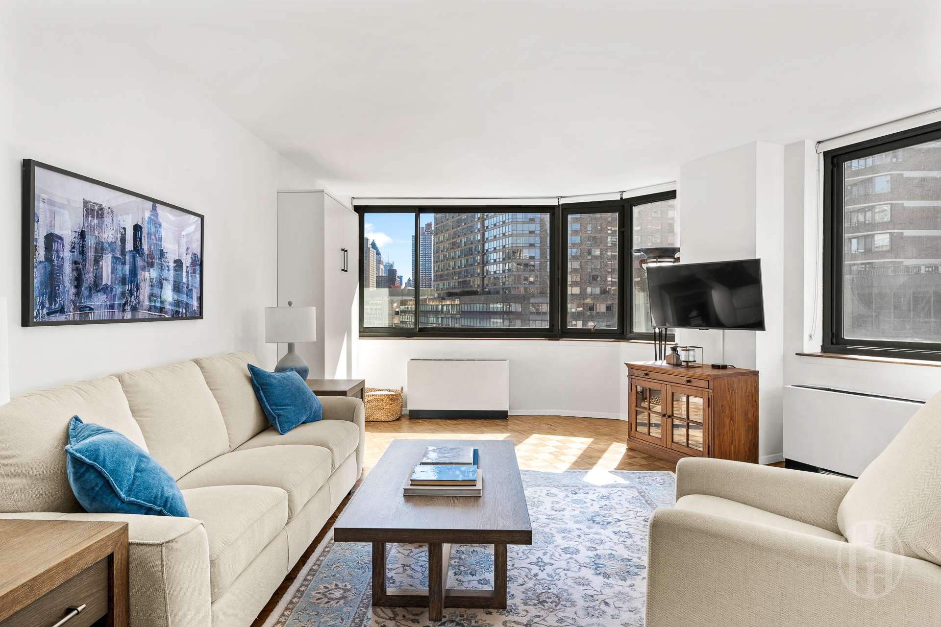 2000 Broadway, Unit 7H Manhattan, NY 10023 - Photo 1 of 13 a living room with furniture and a flat screen tv
