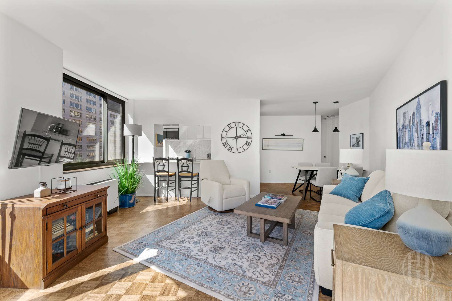 2000 Broadway, Unit 7H Manhattan, NY 10023 - Photo 3 of 13 a living room with furniture and a flat screen tv