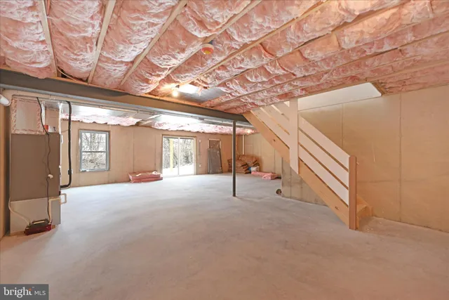 a view of an empty room with windows