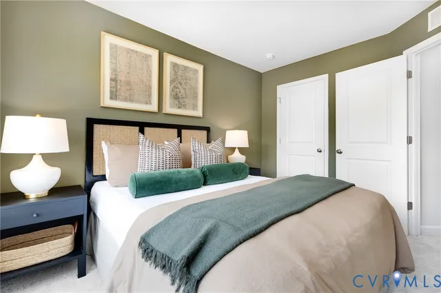 a bedroom with bed and a large window