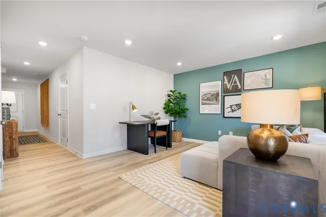 a bedroom with furniture and a window