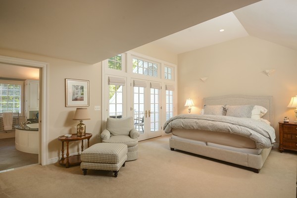 45 Falmouth Road Wellesley, MA 02481 - Photo 11 of 27 a spacious bedroom with a bed and glass window