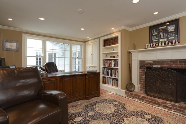 45 Falmouth Road Wellesley, MA 02481 - Photo 18 of 27 a living room with furniture and a fireplace