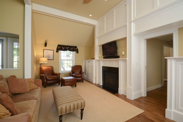 45 Falmouth Road Wellesley, MA 02481 - Photo 19 of 27 a living room with furniture fireplace and flat screen tv